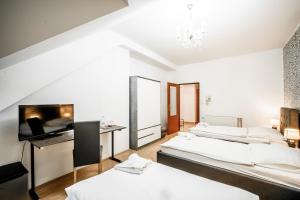 Postel nebo postele na pokoji v ubytování Hotel Panský dům