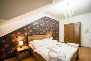 Postel nebo postele na pokoji v ubytování Hotel Panský dům