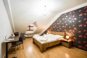 Postel nebo postele na pokoji v ubytování Hotel Panský dům