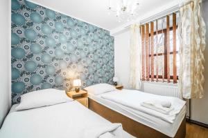 Postel nebo postele na pokoji v ubytování Hotel Panský dům