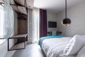 Postel nebo postele na pokoji v ubytování Calle Suite Lazise