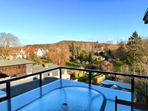 a view from the balcony of a house with a glass table at Just Pension & Bar in Gadebusch