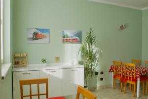 a kitchen and dining room with a table and chairs at B&B Il Riccio in Tirano