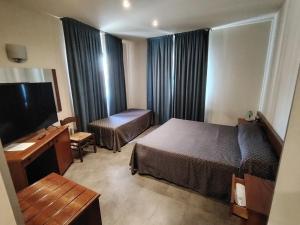 Posteľ alebo postele v izbe v ubytovaní Albergo Centrale