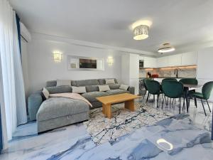 a living room with a couch and a table at Mareverde Dream in Costa de Adeje