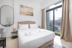 Postel nebo postele na pokoji v ubytování New Listing - TOP Amenities in JVC + 28 fotografií