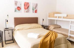 Ένα ή περισσότερα κρεβάτια σε δωμάτιο στο Hotel Rg