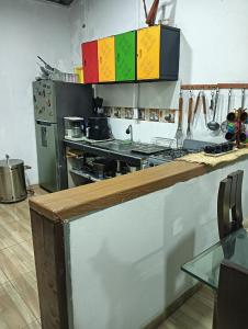a kitchen with a stove and a counter in a kitchen at La casa de mesetas in Mesetas