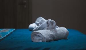 a pile of towels sitting on top of a bed at Villa Katerina in Polykárpion +39 photos