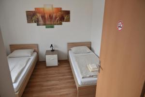 Postel nebo postele na pokoji v ubytování Pension Haus Nova