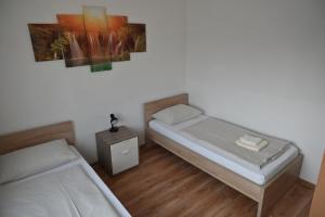 Postel nebo postele na pokoji v ubytování Pension Haus Nova
