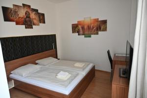 Postel nebo postele na pokoji v ubytování Pension Haus Nova