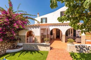an external view of a house with a garden at Villa Verde Ciutadella by Villa Plus in Tres Alquerías