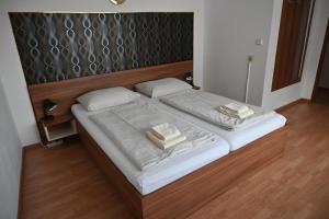 Postel nebo postele na pokoji v ubytování Pension Haus Nova