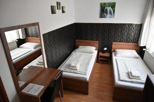 Postel nebo postele na pokoji v ubytování Pension Haus Nova