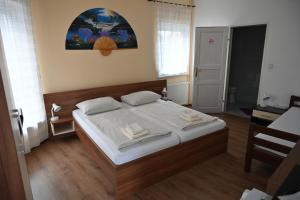 Postel nebo postele na pokoji v ubytování Pension Haus Nova
