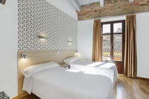 Posteľ alebo postele v izbe v ubytovaní Atenas Granada