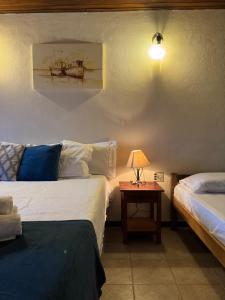 Postel nebo postele na pokoji v ubytování POUSO DE ICARO - POUSADA NO CENTRO de PARATY