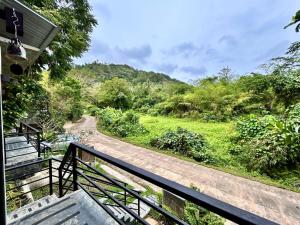 a view from the stairs of a house at Phuchada Residence in Nai Yang Beach