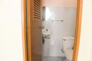 a bathroom with a toilet and a sink at Iloilo Transient Rooms Good for 15-20 pax in Iloilo City