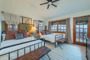 a bedroom with two beds and a television in it at Mountain Views Hot Tub Family Room & Game Room in Swiss +50 photos