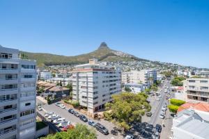 an aerial view of a city with a mountain in the background at The Tropicana Hotel in Cape Town