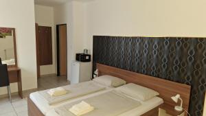 Postel nebo postele na pokoji v ubytování Pension Haus Nova