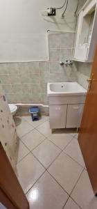a bathroom with a sink and a toilet at Veranda Sul Beach Di Alcamo Marina in Alcamo Marina +37 photos