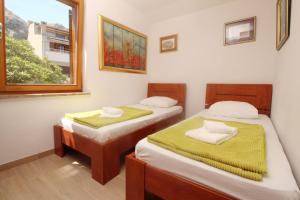Posteľ alebo postele v izbe v ubytovaní Apartments Mrkus