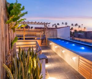 a swimming pool on the roof of a house at Pousada Baobá in Jericoacoara