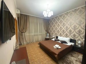 TV a/nebo společenská místnost v ubytování Dvoryanskiy Hotel