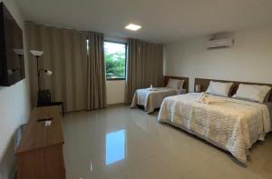 Postel nebo postele na pokoji v ubytování Hotel Formosa - Posto da Mata