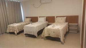 Postel nebo postele na pokoji v ubytování Hotel Formosa - Posto da Mata