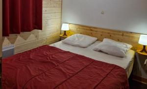 Ένα ή περισσότερα κρεβάτια σε δωμάτιο στο Chalet Jonquille 1