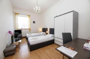 Postel nebo postele na pokoji v ubytování Hotel Panský dům