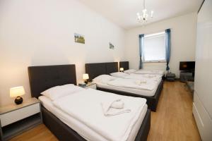 Postel nebo postele na pokoji v ubytování Hotel Panský dům