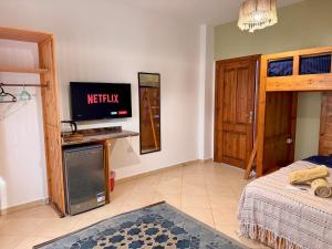 a living room with a tv on the wall at Ocean Life Dahab in Dahab
