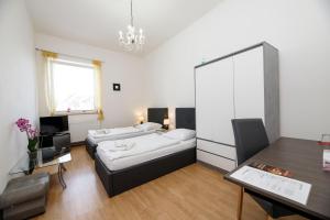 Postel nebo postele na pokoji v ubytování Hotel Panský dům