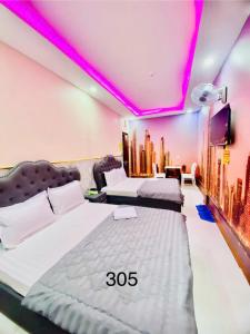 Postel nebo postele na pokoji v ubytování B & K Hotel - District 10
