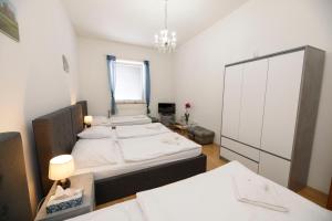 Postel nebo postele na pokoji v ubytování Hotel Panský dům