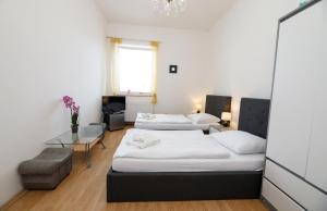 Postel nebo postele na pokoji v ubytování Hotel Panský dům