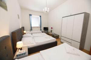 Postel nebo postele na pokoji v ubytování Hotel Panský dům