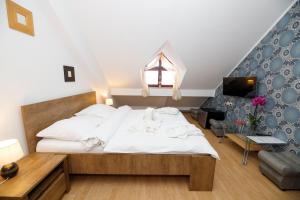 Postel nebo postele na pokoji v ubytování Hotel Panský dům