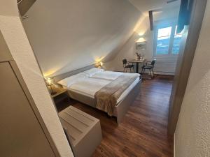 Apart-Hôtel Pont-de-Thielle客房内的一张或多张床位