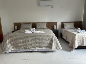 Postel nebo postele na pokoji v ubytování Hotel Formosa - Posto da Mata
