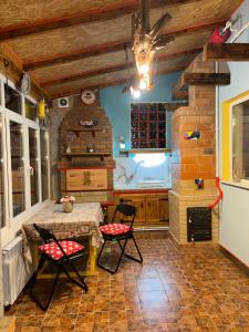 a kitchen with a table and chairs in a room at Red Star Peoples Republic in Tiraspol