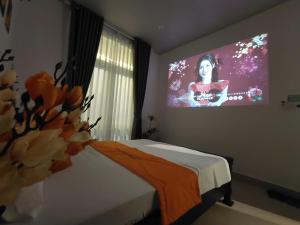 TV a/nebo společenská místnost v ubytování Skylight Homestay + 19 fotografií