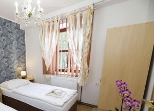 Postel nebo postele na pokoji v ubytování Hotel Panský dům