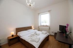 Postel nebo postele na pokoji v ubytování Hotel Panský dům