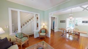 a living room with a table and chairs and a dining room at Jasmine Place in Key West